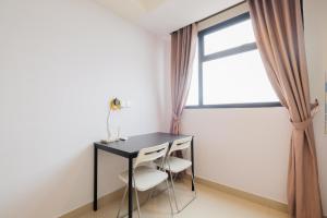 Minimalist 1BR with Extra Room at Evenciio Margonda Apartment By Travelio