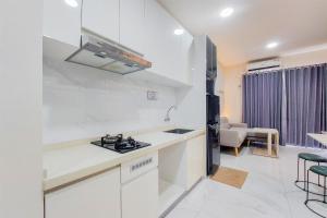 Elegant and Strategic 2BR Sky House BSD Apartment near ICE BSD By Travelio