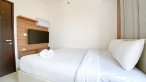 Nice and Homey 2BR at Citra Living Apartment By Travelio