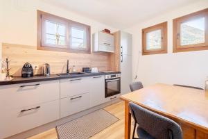 Appartements Au centre cosy et neuf proche station ski parking terasse : photos des chambres