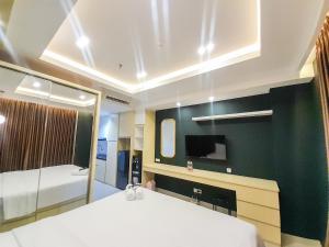 Great Deal and Cozy Studio Patraland Amarta Apartment By Travelio