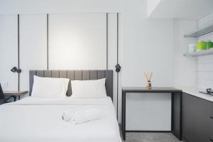 Warm and Simply Studio Room at Urbantown Serpong Apartment By Travelio