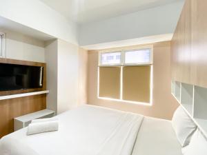 Homey and Nice 3BR at Springlake Summarecon Bekasi Apartment By Travelio