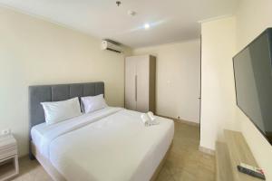 Spacious and Elegant Designed 3BR at Menteng Park Apartment By Travelio