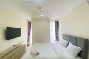 Spacious and Elegant Designed 3BR at Menteng Park Apartment By Travelio