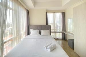 Spacious and Elegant Designed 3BR at Menteng Park Apartment By Travelio