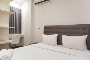 Simply Cozy 1BR at Asatti Apartment By Travelio