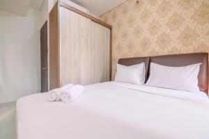Good Deal and Relaxing 2BR Transpark Cibubur Apartment By Travelio