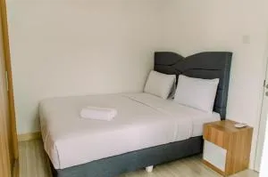 Tranquil and Warm 2BR Apartment at Urban Heights Residences BSD City By Travelio - Dukuh