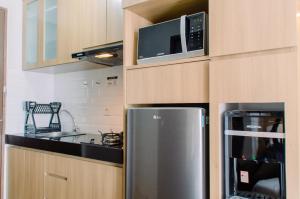 Nice and Fancy Studio at Transpark Bintaro Apartment By Travelio