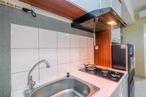 Elegant and Nice Studio at Springlake Summarecon Apartment By Travelio