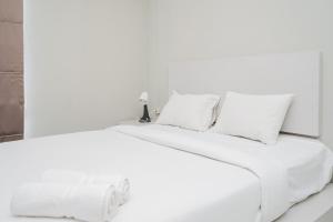 Homey and Simply 2BR at Akasa Pure Living BSD Apartment By Travelio