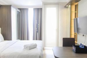 Nice and Fancy Studio Room at Menteng Park Apartment By Travelio