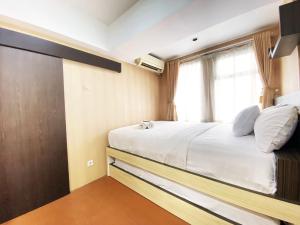 Homey 1BR at Jarrdin Cihampelas Apartment By Travelio