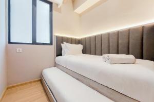 Spacious and Nice 2BR at Sky House BSD Apartment By Travelio