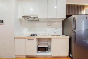 Spacious and Nice 2BR at Sky House BSD Apartment By Travelio