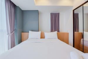 Scenic and Comfortable 1BR Apartment Branz BSD City By Travelio