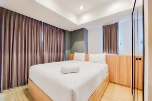 Scenic and Comfortable 1BR Apartment Branz BSD City By Travelio
