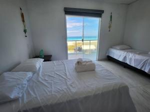 Pé na areia, refúgio beira-mar