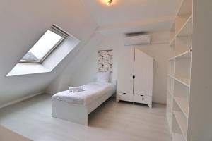 Appartements L-oasis urbaine au coeur de la ville - Parking - Mon Groom : photos des chambres