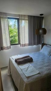 Vila Manah 203, Quarto e sala, acomoda 4 pessoas com Ar Condicionado, Wifi, Smart Tv, Cozinha completa, Portaria 24h e Estacionamento