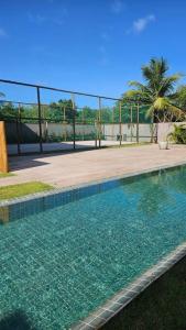 Vila Manah 203, Quarto e sala, acomoda 4 pessoas com Ar Condicionado, Wifi, Smart Tv, Cozinha completa, Portaria 24h e Estacionamento