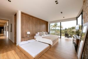 Villa al lado de la represa de Guatapé con jacuzzi y cancha de tennis privada