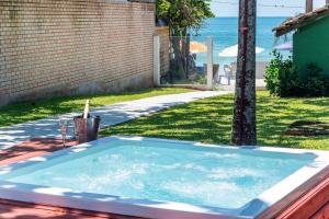 Casa Beira mar, com Jacuzzi no centro de Bombinhas