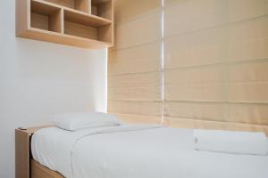 Nice and Comfy 2BR Apartment at M-Town Residence near Summarecon By Travelio