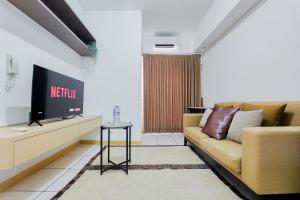 Homey and Modern 2BR Apartment at M-Town Residence By Travelio