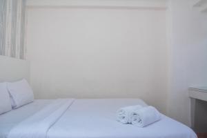 Minimalist and Warm 2BR at Bassura City Apartment By Travelio