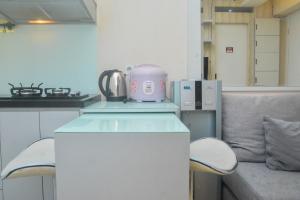 Minimalist and Warm 2BR at Bassura City Apartment By Travelio