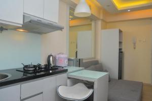 Minimalist and Warm 2BR at Bassura City Apartment By Travelio