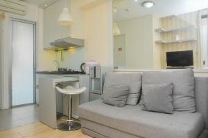 Minimalist and Warm 2BR at Bassura City Apartment By Travelio