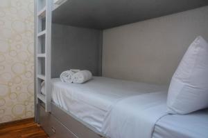 Minimalist and Warm 2BR at Bassura City Apartment By Travelio