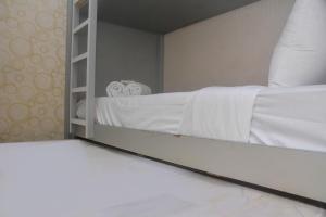 Minimalist and Warm 2BR at Bassura City Apartment By Travelio