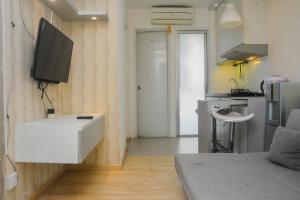 Minimalist and Warm 2BR at Bassura City Apartment By Travelio