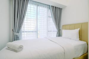 Wonderful and Homey 1BR The Smith Alam Sutera Apartment By Travelio