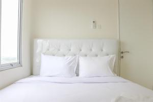 Stunning and Comfy 2BR Bassura City Apartment By Travelio