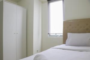 Stunning and Comfy 2BR Bassura City Apartment By Travelio