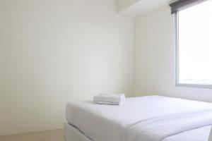 Stunning and Comfy 2BR Bassura City Apartment By Travelio