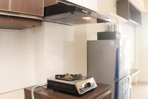 Nice and Elegant Studio Apartment at Mustika Golf Residence By Travelio