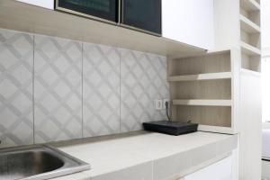 Cozy and Nice Studio Apartment at Mekarwangi Square Cibaduyut By Travelio