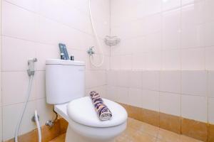 Cozy Living and Modern 2BR Bassura City Apartment By Travelio