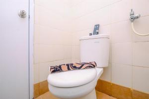 Cozy Living and Modern 2BR Bassura City Apartment By Travelio