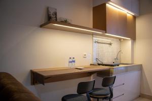 Modern and Classic 1BR at Evenciio Margonda Apartment By Travelio