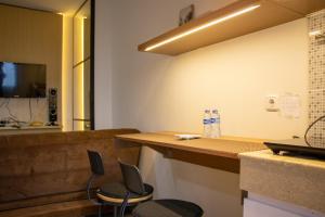 Modern and Classic 1BR at Evenciio Margonda Apartment By Travelio