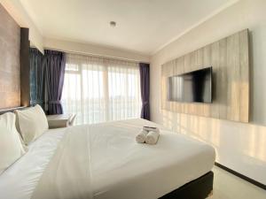 Comfy Studio at Gateway Pasteur Apartment By Travelio