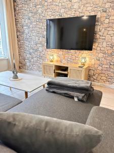 Appartements Maison cosy avec jardin, wifi et parking gratuit : photos des chambres