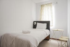 High Floor and Comfort Living 2BR Apartment at Thamrin Residence By Travelio